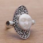 Blue topaz cocktail ring, 'Tranquil in Blue' - Carved Cow Bone Sterling Silver Blue Topaz Cocktail Ring