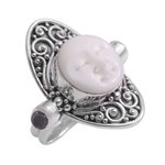 Blue topaz cocktail ring, 'Tranquil in Blue' - Carved Cow Bone Sterling Silver Blue Topaz Cocktail Ring