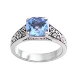 Blue topaz solitaire ring, 'Sparkling Heavens' - Blue Topaz and Sterling Silver Swirl Motif Solitaire Ring