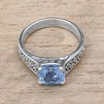 Blue topaz solitaire ring, 'Sparkling Heavens' - Blue Topaz and Sterling Silver Swirl Motif Solitaire Ring