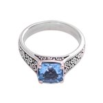 Blue topaz solitaire ring, 'Sparkling Heavens' - Blue Topaz and Sterling Silver Swirl Motif Solitaire Ring