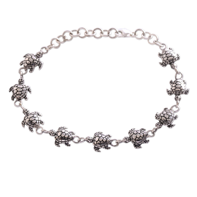 Sterling silver link bracelet, 'Turtle Promenade' - Handcrafted Sterling Silver Turtle Link Bracelet from Bali