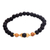Gold accent lava stone beaded stretch bracelet, 'Batuan Tune' - Lava Stone Bracelet with Gold Plated Beads