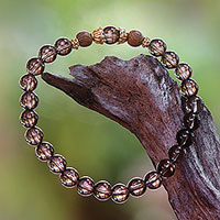 Gold accent smoky quartz beaded stretch bracelet, 'Batuan Tune' - Smoky Quartz Beaded Stretch Bracelet with Wood Accents