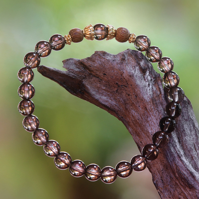 Gold accent smoky quartz beaded stretch bracelet, 'Batuan Tune' - Smoky Quartz Beaded Stretch Bracelet with Wood Accents