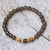 Gold accent smoky quartz beaded stretch bracelet, 'Batuan Tune' - Smoky Quartz Beaded Stretch Bracelet with Wood Accents (image 2b) thumbail