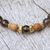 Gold accent smoky quartz beaded stretch bracelet, 'Batuan Tune' - Smoky Quartz Beaded Stretch Bracelet with Wood Accents (image 2c) thumbail