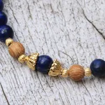 Gold accented lapis lazuli beaded stretch bracelet, 'Batuan Tune' - Gold Accented Lapis Lazuli Beaded Stretch Bracelet from Bali