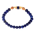Gold accented lapis lazuli beaded stretch bracelet, 'Batuan Tune' - Gold Accented Lapis Lazuli Beaded Stretch Bracelet from Bali
