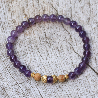 Gold accent amethyst beaded stretch bracelet, 'Batuan Tune' - Amethyst Beaded Bracelet with 22k Gold Plated Accents
