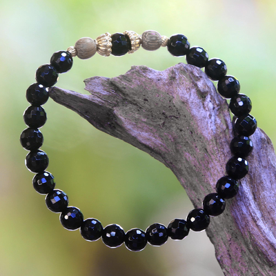 Gold accented onyx beaded stretch bracelet, 'Batuan Tune' - Gold Accented Onyx Beaded Stretch Bracelet from Bali