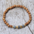 Gold accent wood and labradorite beaded stretch bracelet, 'Batuan Harmony' - Coconut Wood and Labradorite Beaded Stretch Bracelet (image 2b) thumbail