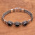 Onyx pendant bracelet, 'Fascinating Petals' - Three-Stone Onyx Pendant Bracelet from Bali thumbail