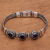 Amethyst pendant bracelet, 'Fascinating Petals' - Three-Stone Amethyst Pendant Bracelet from Bali