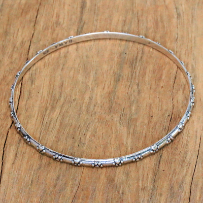 Sterling silver bangle bracelet, 'Puppy World' - Sterling Silver Bangle Bracelet with Paw Print Motifs