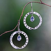 Blue topaz dangle earrings, 'Paw Twist' - Animal-Themed Circular Blue Topaz Dangle Earrings from Bali