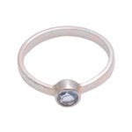Blue topaz solitaire ring, 'Pretty Paradox' - Blue Topaz and Hammered Sterling Silver Solitaire Ring