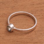 Blue topaz solitaire ring, 'Pretty Paradox' - Blue Topaz and Hammered Sterling Silver Solitaire Ring