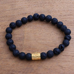 Men's gold accented lava stone beaded stretch bracelet, 'Batur Pebbles' - Men's Gold Accent Lava Stone Beaded Stretch Bracelet