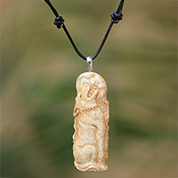Bone pendant necklace, 'Wolf Howl' - Wolf-Themed Bone Pendant Necklace from Bali