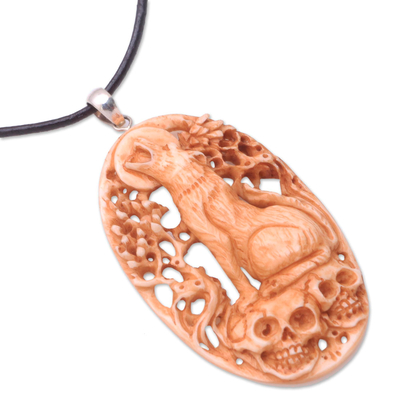 Bone pendant necklace, 'Setra Wolf' - Hand-Carved Bone Wolf Pendant Necklace from Bali