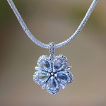 Blue topaz pendant necklace, 'Bougainvillea Flower' - Floral Blue Topaz and Sterling Silver Pendant Necklace