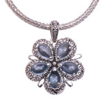 Blue topaz pendant necklace, 'Bougainvillea Flower' - Floral Blue Topaz and Sterling Silver Pendant Necklace