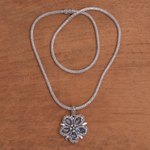 Blue topaz pendant necklace, 'Bougainvillea Flower' - Floral Blue Topaz and Sterling Silver Pendant Necklace