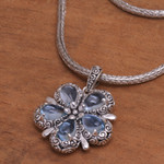 Blue topaz pendant necklace, 'Bougainvillea Flower' - Floral Blue Topaz and Sterling Silver Pendant Necklace