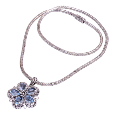 Blue topaz pendant necklace, 'Bougainvillea Flower' - Floral Blue Topaz and Sterling Silver Pendant Necklace