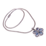Blue topaz pendant necklace, 'Bougainvillea Flower' - Floral Blue Topaz and Sterling Silver Pendant Necklace