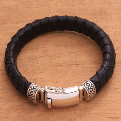 Men's leather braided wristband bracelet, 'Jagaraga Swirl' - Men's Sterling Silver and Braided Black Leather Bracelet