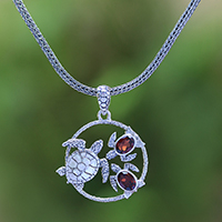 Garnet pendant necklace, 'Sea Turtle Family' - Garnet Sea Turtle Pendant Necklace from Bali