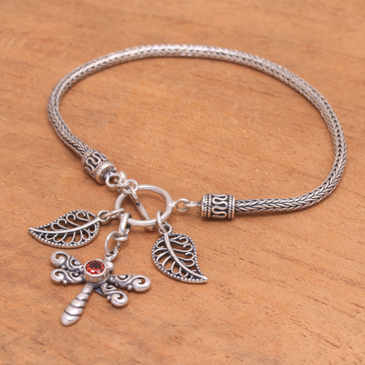 Garnet charm bracelet, 'Dragonfly Dawn' - Garnet Dragonfly Charm Bracelet from Bali