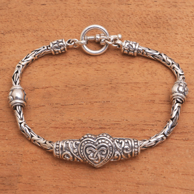 Sterling silver pendant bracelet, 'Heart Knot' - Heart-Shaped Sterling Silver Pendant Bracelet from Bali