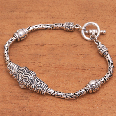 Sterling silver pendant bracelet, 'Heart Knot' - Heart-Shaped Sterling Silver Pendant Bracelet from Bali