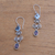 Garnet and blue topaz dangle earrings, 'Sky Flare' - Blue Topaz and Garnet Sterling Silver Dangle Earrings thumbail