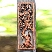 Wood relief panel, 'Righteous Tree' - Hand-Carved Tree-Themed Suar Wood Relief Panel from Bali