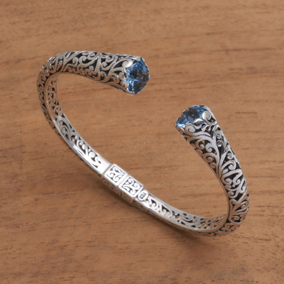 Blue topaz cuff bracelet, 'A Glimpse of Sky' - Blue Topaz and Sterling Silver Scroll Motif Cuff Bracelet