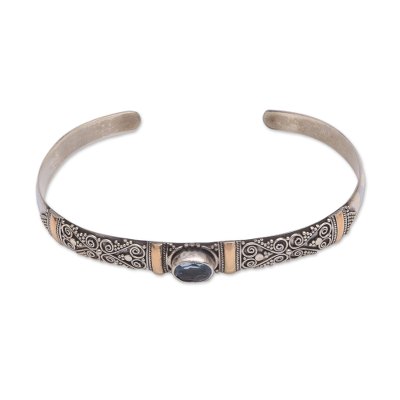 Gold accented blue topaz cuff bracelet, 'Artful Sky' - Blue Topaz Sterling Silver and 18K Gold Accent Cuff Bracelet