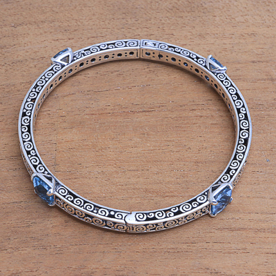 Blue topaz bangle bracelet, 'Bejeweled' - 10-Carat Blue Topaz Bangle Bracelet from Bali