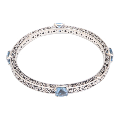 Blue topaz bangle bracelet, 'Bejeweled' - 10-Carat Blue Topaz Bangle Bracelet from Bali