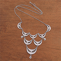 Sterling silver filigree pendant necklace, 'Sabit Moon' - Crescent Sterling Silver Filigree Pendant Necklace from Java