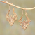 Gold plated drop earrings, 'Alam Pride' - Curl Pattern Gold Plated Brass Drop Earrings from Bali