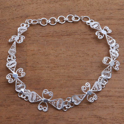 Sterling silver filigree link bracelet, 'Ribbon Charm' - Sterling Silver Filigree Ribbon Link Bracelet from Java