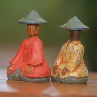Wood figurines, 'Traditional Couple' (pair) - Red and Yellow Wood Farmer Figurines from Bali (Pair)