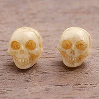 Bone stud earrings, 'Faces of Trunyan' - Hand-Carved Skull Bone Stud Earrings from Bali