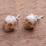 Bone stud earrings, 'Faces of Trunyan' - Hand-Carved Skull Bone Stud Earrings from Bali