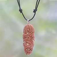 Bone pendant necklace, 'Protective Dragon' - Hand-Carved Bone Dragon Pendant Necklace from Bali