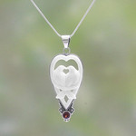 Garnet and bone pendant necklace, 'Dove Couple' - Garnet and Bone Dove Pendant Necklace from Bali